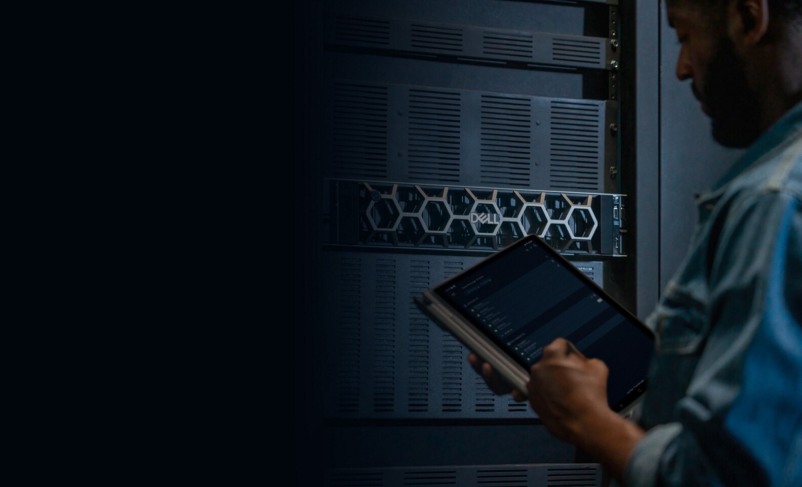 Man Working in Server Room Facing PowerEdge Bezel with OpenManage Mobile